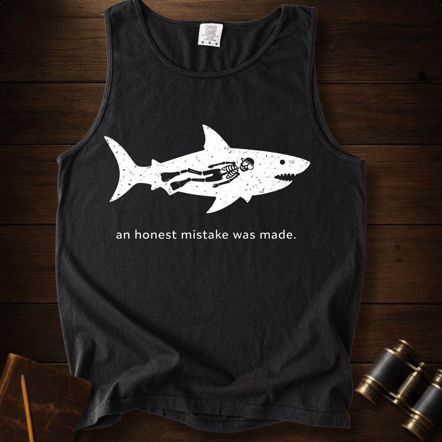 Full Sail Marine An Honest Mistake shark skeleton graphic Comfort Colors tank top in Black – funny ocean art quote design – front view