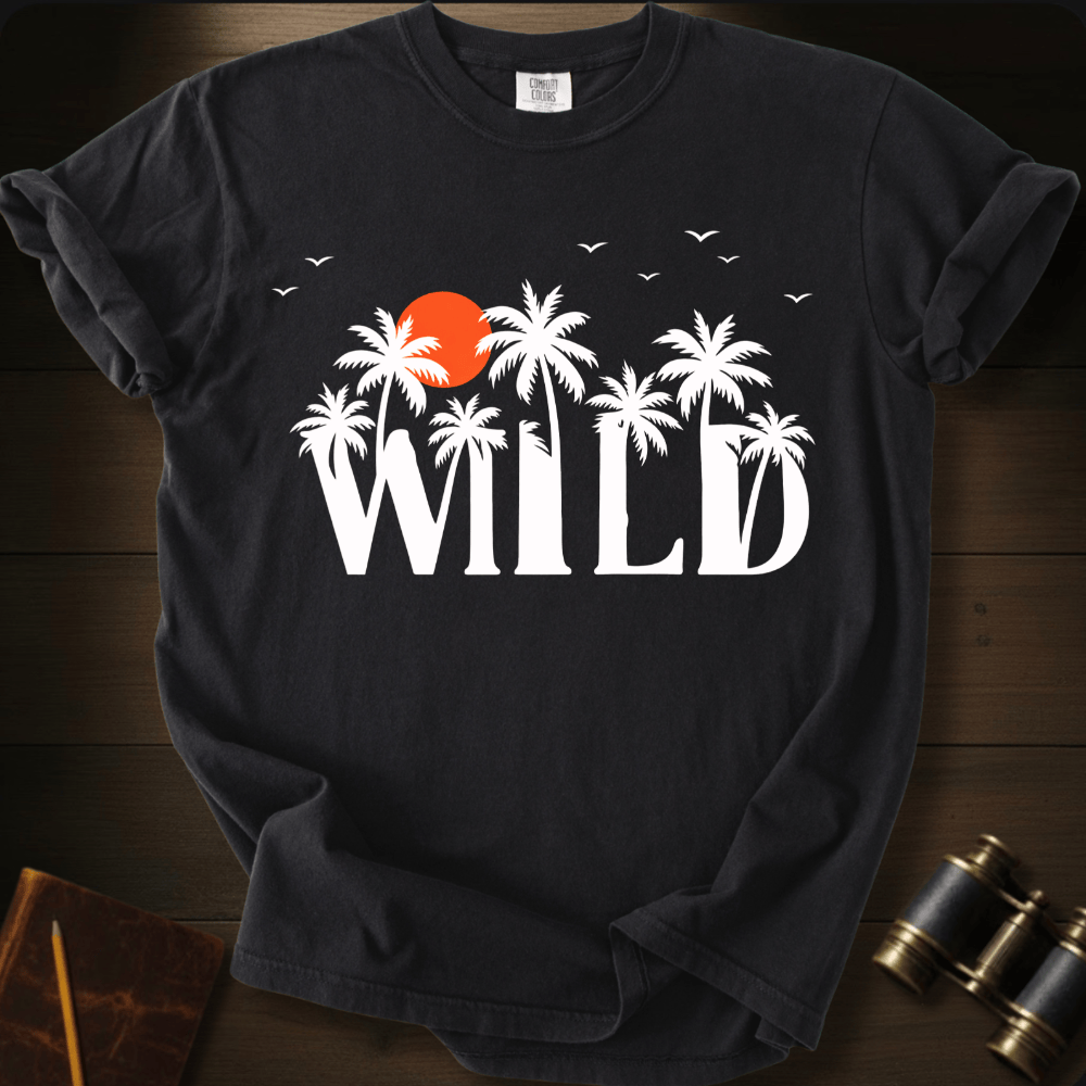 Full Sail Marine Wild palm trees and sunset graphic Comfort Colors t-shirt in black – white tropical WILD text with orange sun and birds design – front view