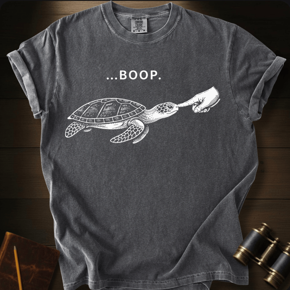Full Sail Marine Turtle Boop sea turtle graphic Comfort Colors t-shirt in pepper – white sea turtle reaching flipper with BOOP text design – front view