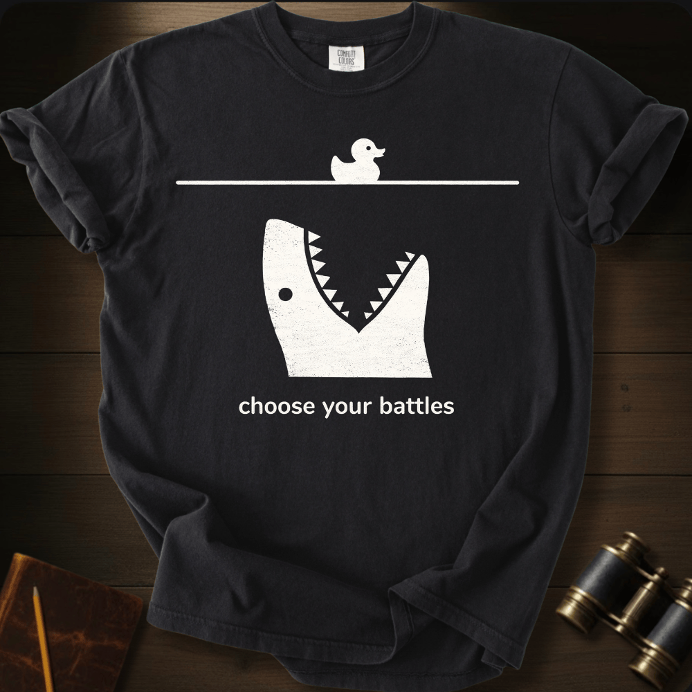Full Sail Marine Choose Your Battles rubber duck and shark jaw funny graphic Comfort Colors t-shirt in black – humorous ocean predator design – front view
