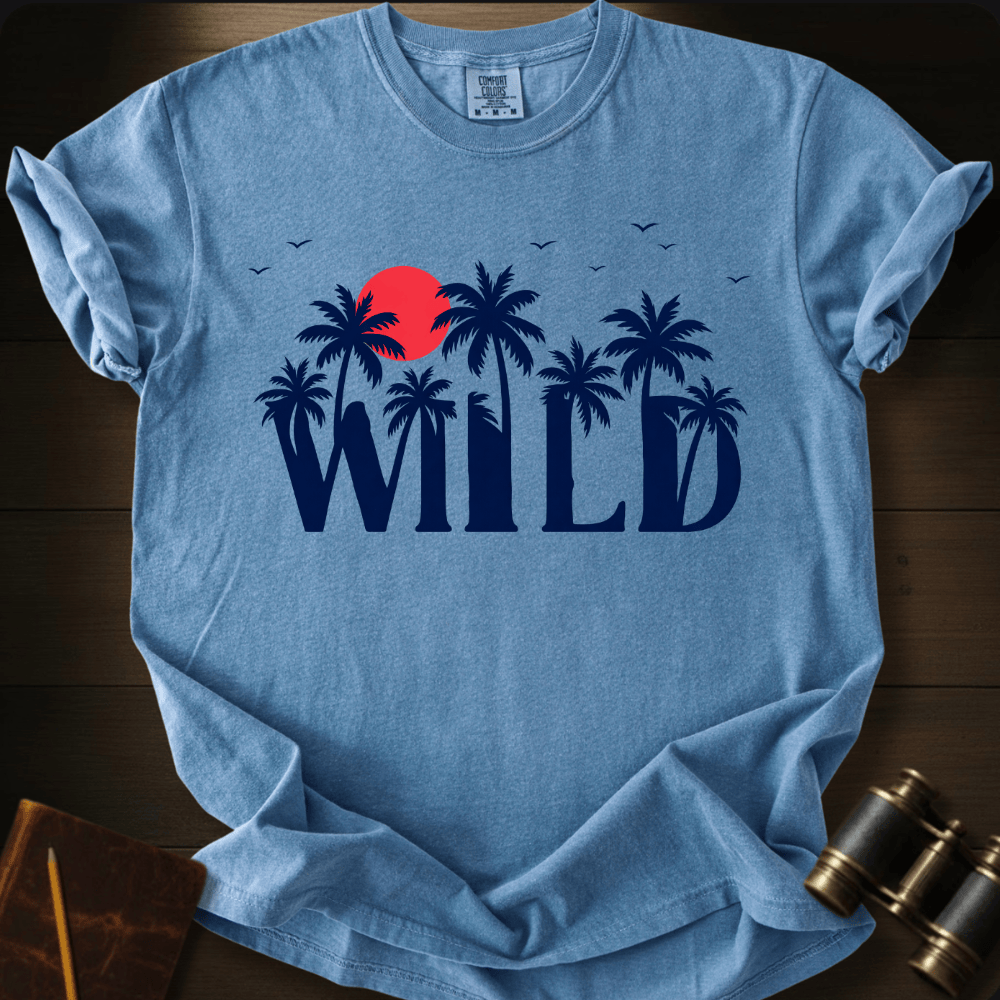 Full Sail Marine Wild palm trees and sunset graphic Comfort Colors t-shirt in blue jean – tropical WILD text with red sun and birds design – front view