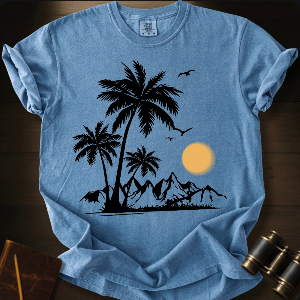 Full Sail Marine Sunfall Palms tropical palm trees and mountains silhouette graphic Comfort Colors t-shirt in blue jean – beach sunset scene with birds design – front view