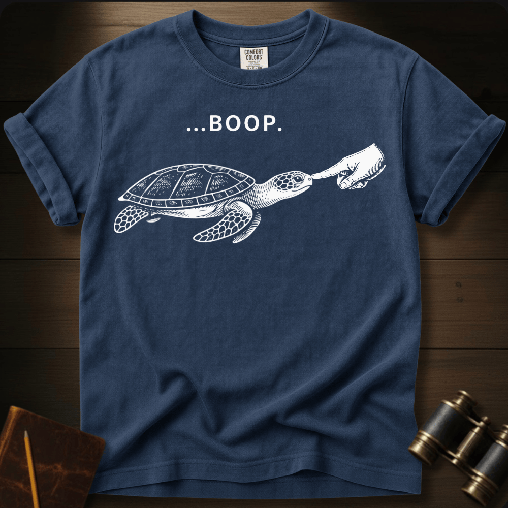 Full Sail Marine Turtle Boop sea turtle graphic Comfort Colors t-shirt in true navy – white sea turtle reaching flipper with BOOP text design – front view