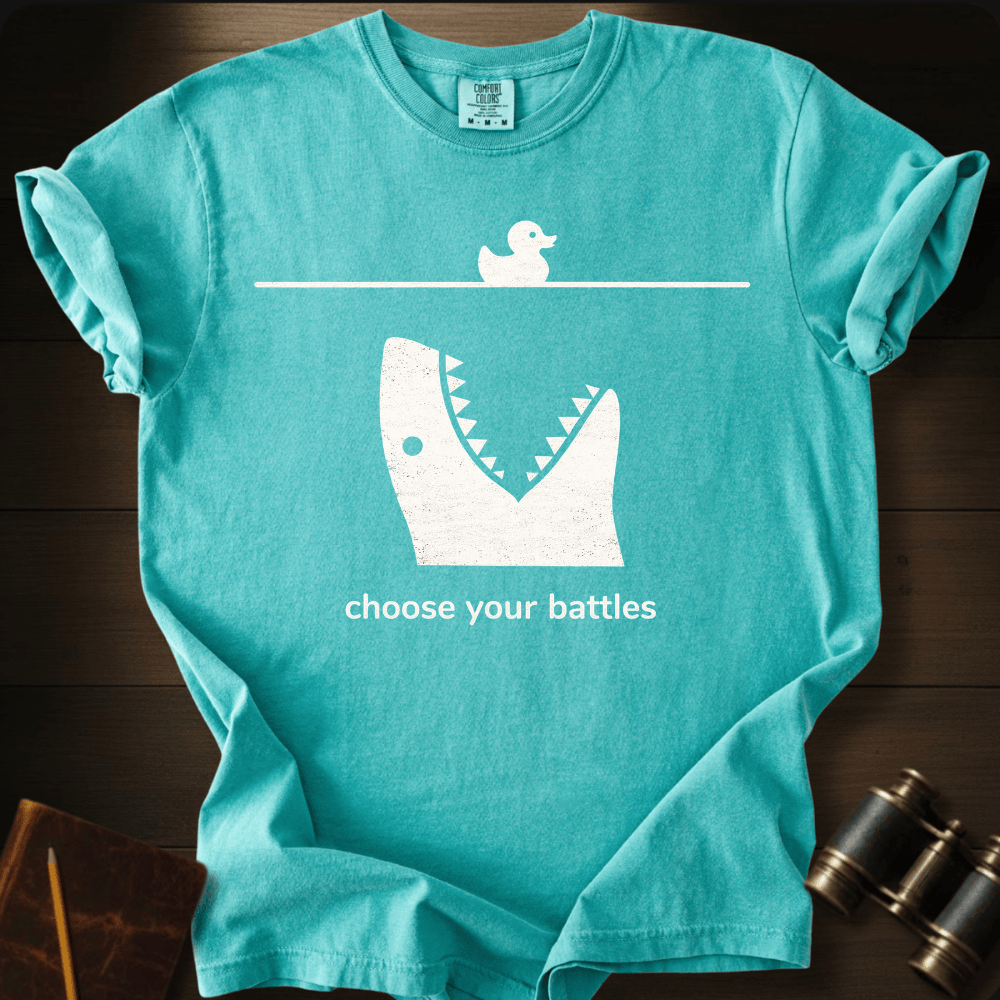 Full Sail Marine Choose Your Battles rubber duck and shark jaw funny graphic Comfort Colors t-shirt in seafoam – humorous ocean predator design – front view