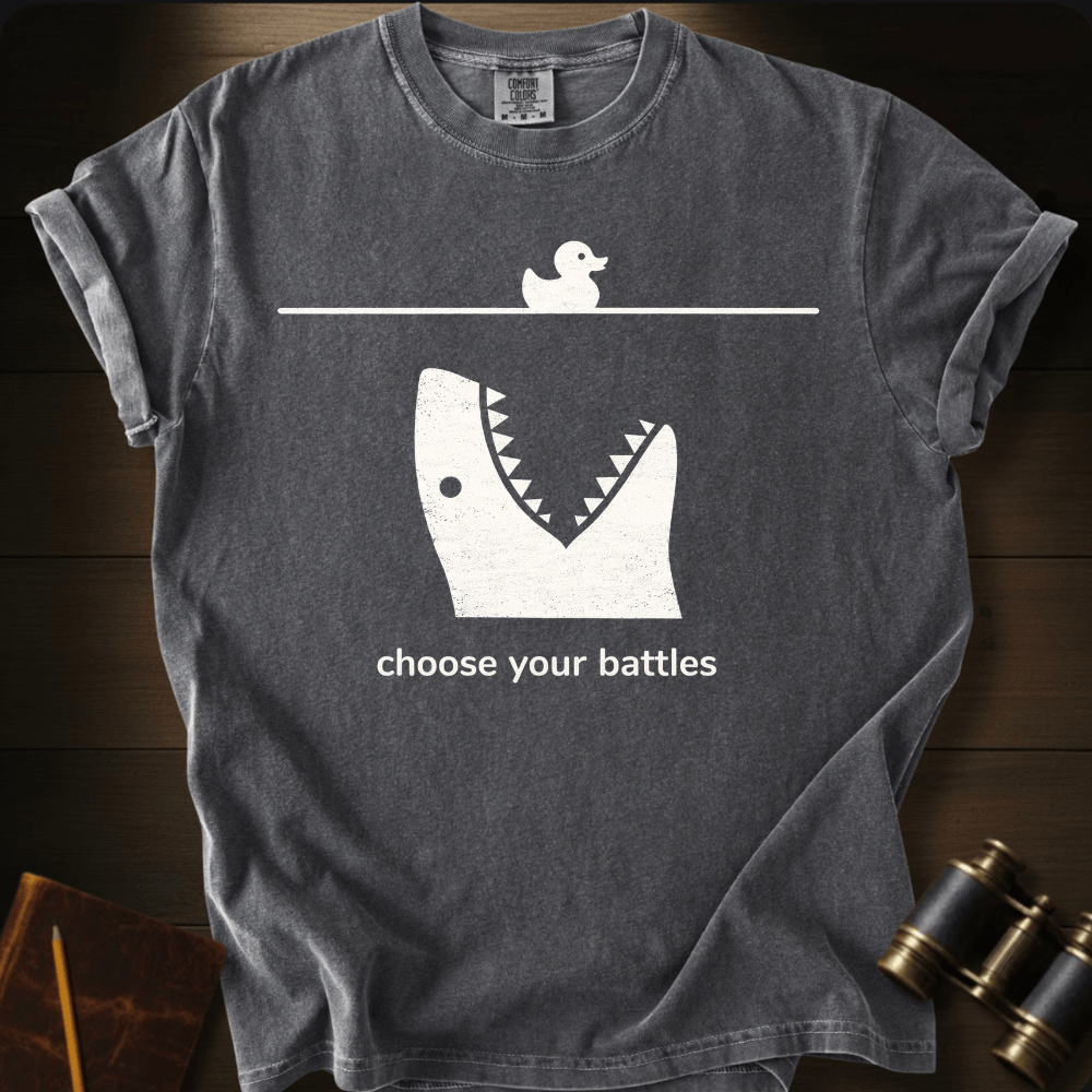 Full Sail Marine Choose Your Battles rubber duck and shark jaw funny graphic Comfort Colors t-shirt in pepper – humorous ocean predator design – front view