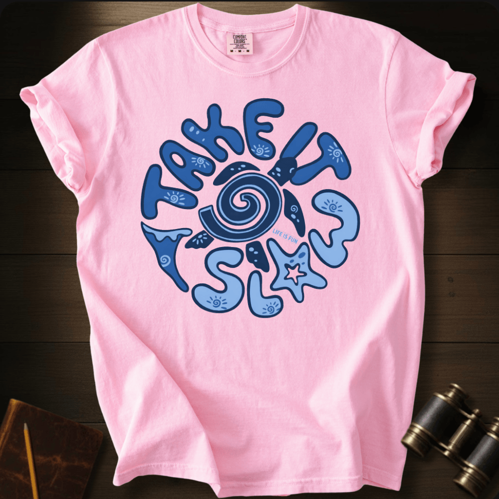 Full Sail Marine Take It Slow turtle swirl graphic Comfort Colors t-shirt in Blossom – navy turtle shell spiral with ocean elements starfish and waves TAKE IT SLOW text design – front view