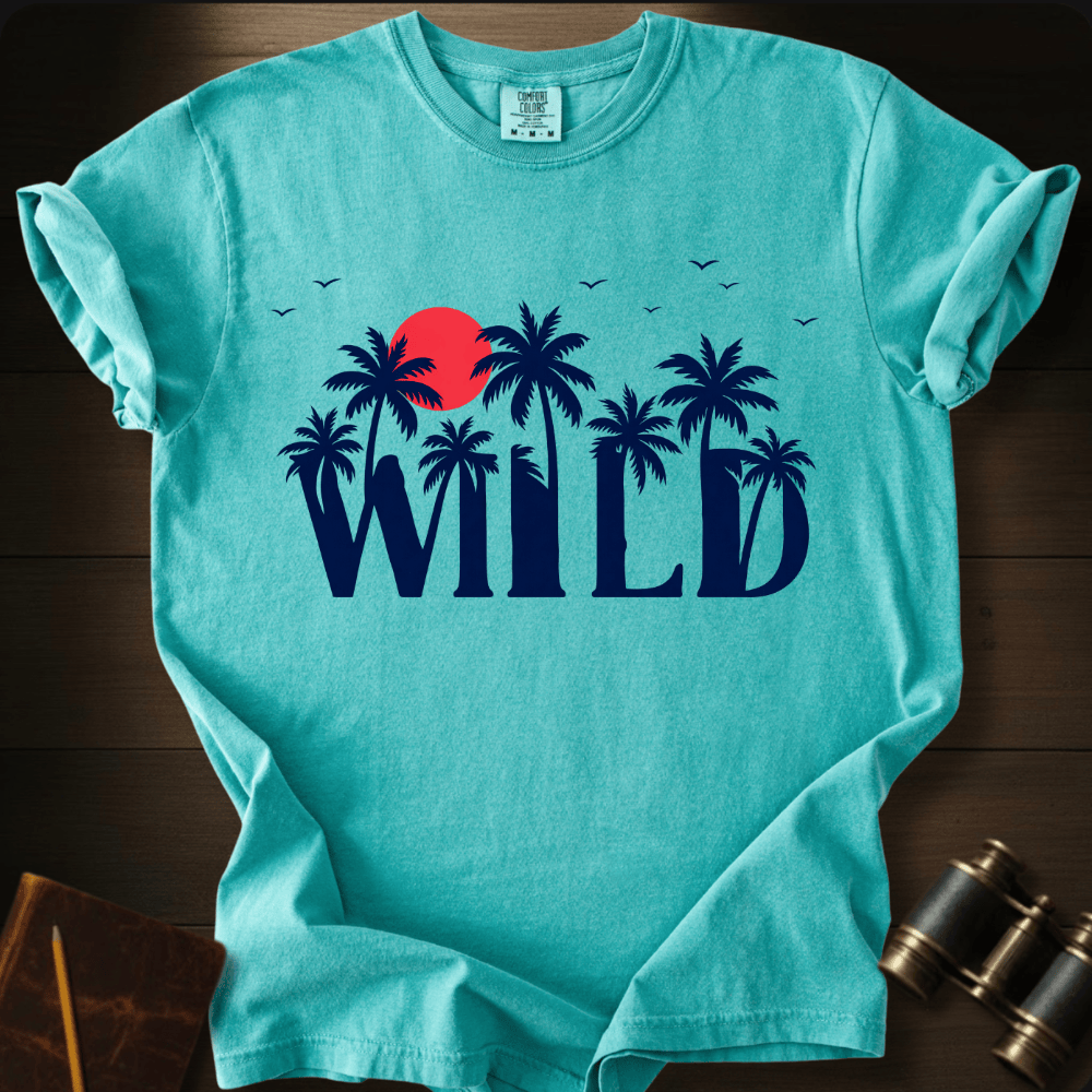 Full Sail Marine Wild palm trees and sunset graphic Comfort Colors t-shirt in chalky mint – tropical WILD text with red sun and birds design – front view