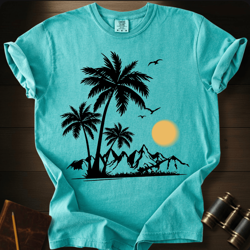 Full Sail Marine Sunfall Palms tropical palm trees and mountains silhouette graphic Comfort Colors t-shirt in chalky mint – beach sunset scene with birds design – front view