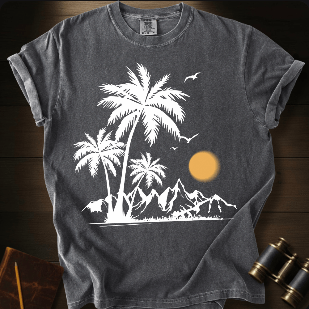 Full Sail Marine Sunfall Palms tropical palm trees and mountains silhouette graphic Comfort Colors t-shirt in pepper – white beach sunset scene with birds design – front view