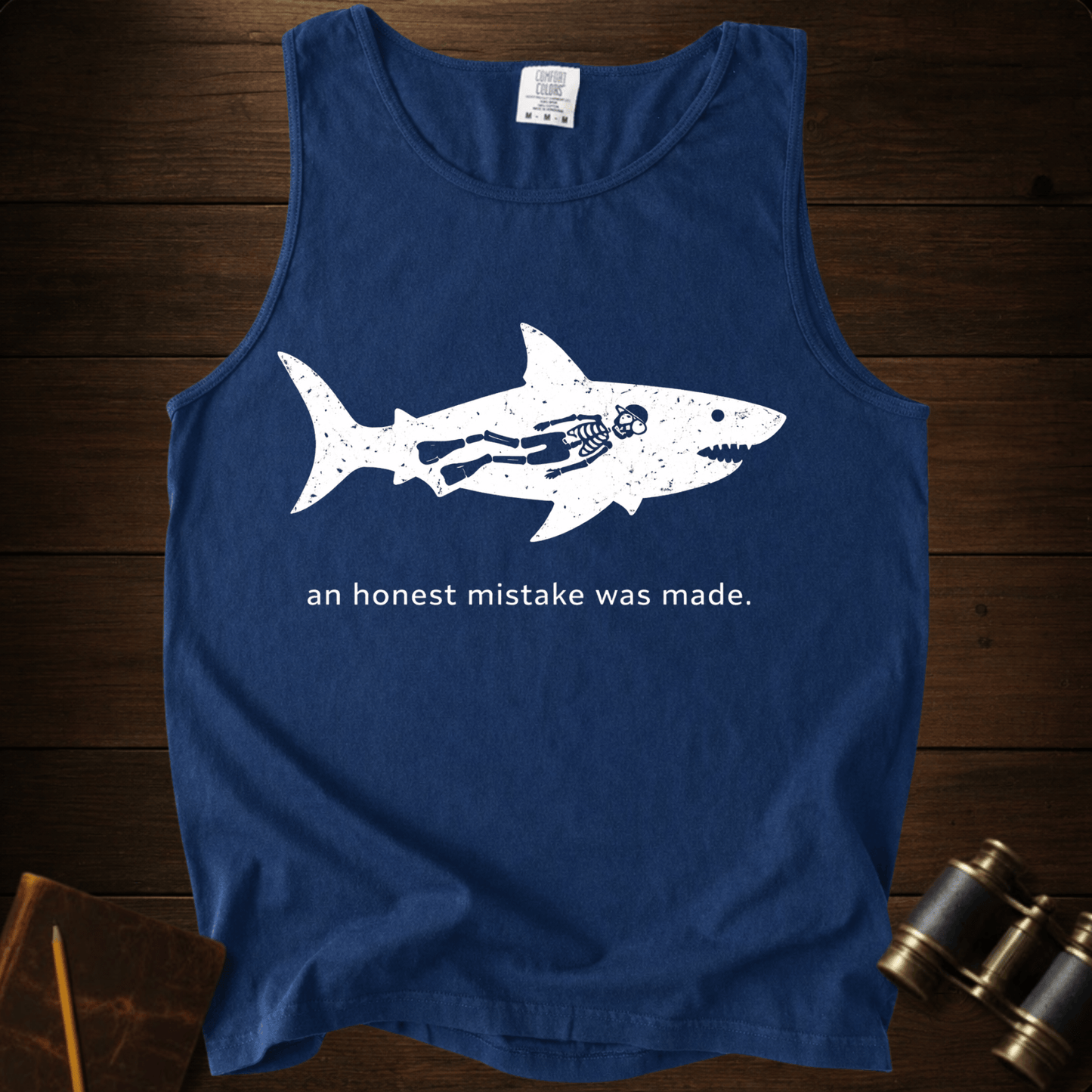 Full Sail Marine An Honest Mistake shark skeleton graphic Comfort Colors tank top in True Navy – funny ocean art quote design – front view