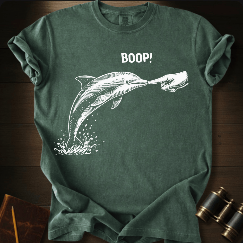 Full Sail Marine Boop! dolphin graphic Comfort Colors t-shirt in moss green – white dolphin being booped on nose with hand and BOOP text design – front view