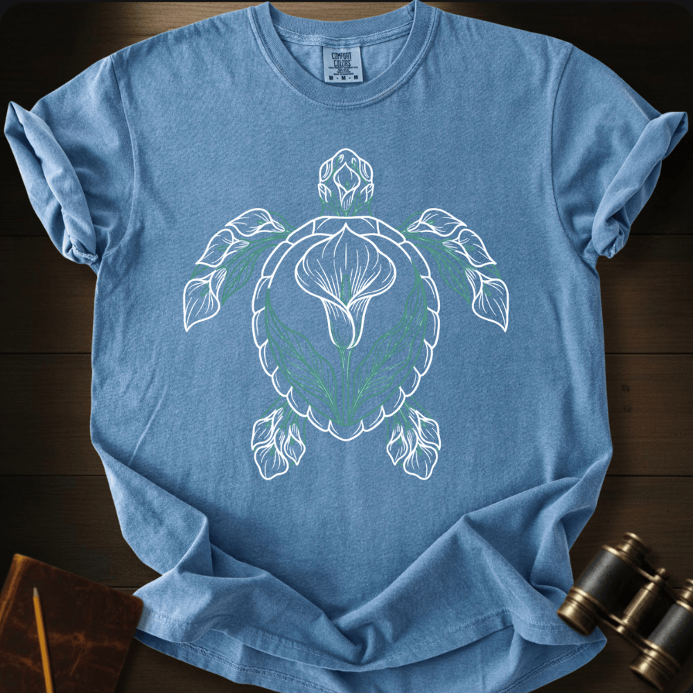 Full Sail Marine Verdant Tide sea turtle graphic Comfort Colors t-shirt in blue jean – botanical leaf turtle ocean art design – front view