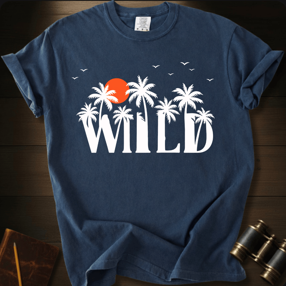 Full Sail Marine Wild palm trees and sunset graphic Comfort Colors t-shirt in true navy – white tropical WILD text with orange sun and birds design – front view