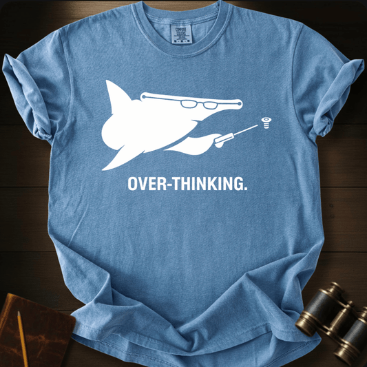 Full Sail Marine Over-Thinking shark with glasses and lightbulb funny graphic Comfort Colors t-shirt in blue jean – humorous brainy ocean design – front view
