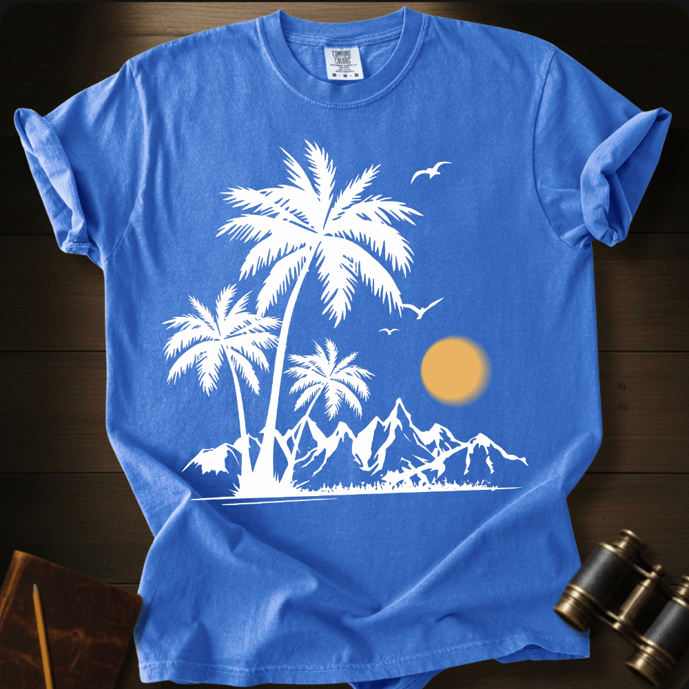 Full Sail Marine Sunfall Palms tropical palm trees and mountains silhouette graphic Comfort Colors t-shirt in flo blue – white beach sunset scene with birds design – front view