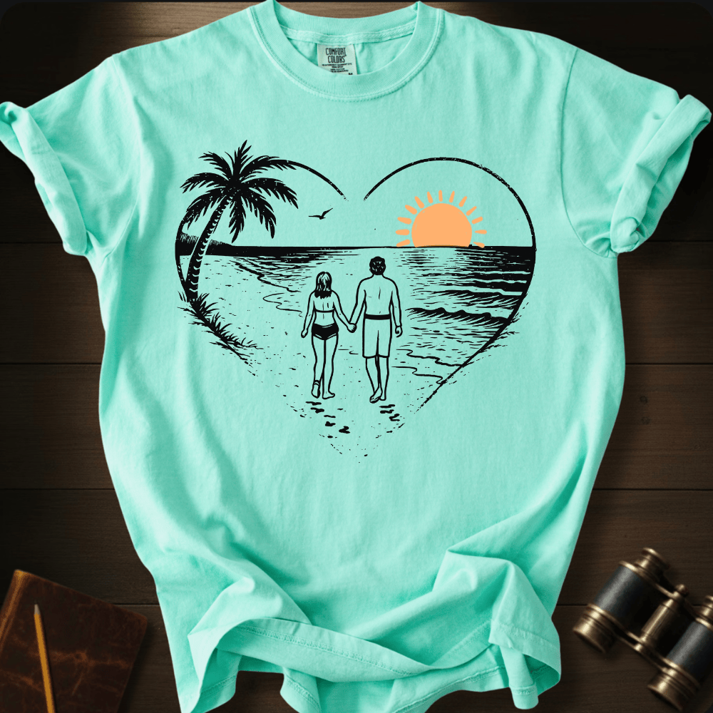 Full Sail Marine Sunset Walk beach couple heart graphic Comfort Colors t-shirt in island reef green – romantic sunset palm tree ocean scene – front view