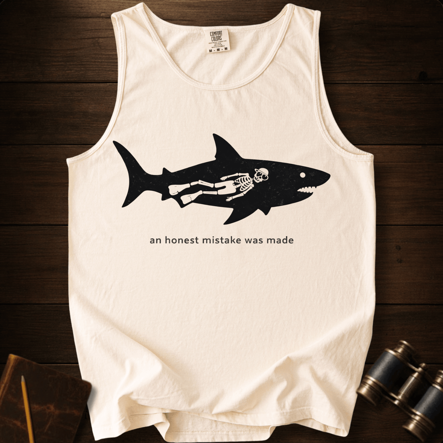 Full Sail Marine An Honest Mistake shark skeleton graphic Comfort Colors tank top in Ivory – funny ocean art quote design – front view