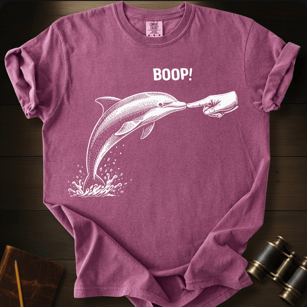 Full Sail Marine Boop! dolphin graphic Comfort Colors t-shirt in berry – white dolphin being booped on nose with hand and BOOP text design – front view