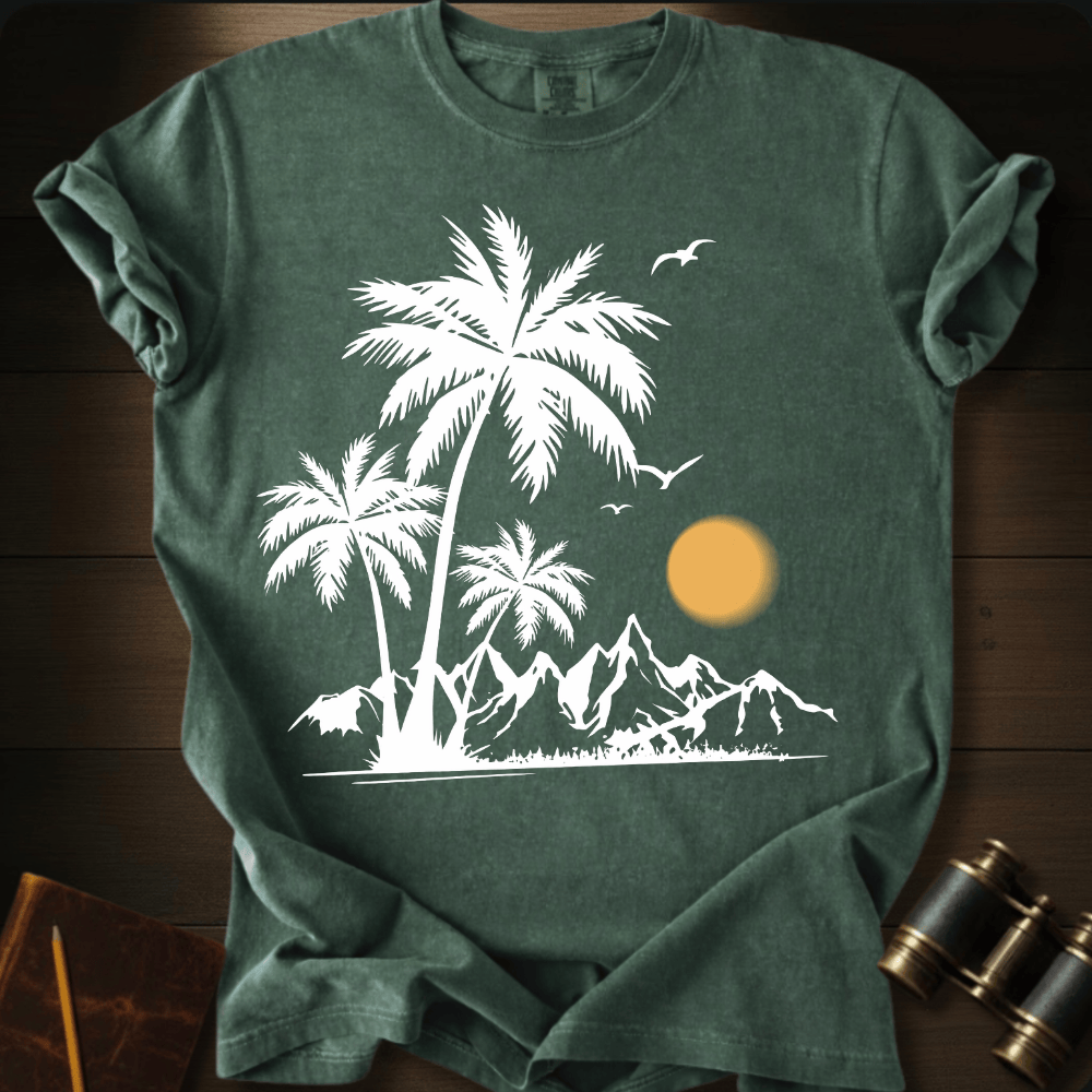 Full Sail Marine Sunfall Palms tropical palm trees and mountains silhouette graphic Comfort Colors t-shirt in hemp green – white beach sunset scene with birds design – front view