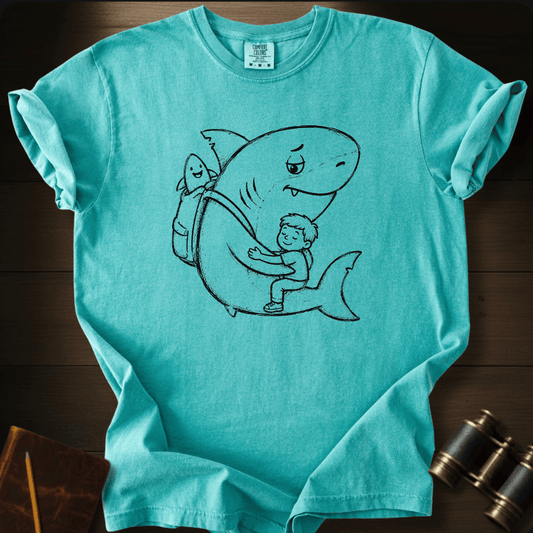 Black line-art of a child hugging a big friendly shark, printed on a mustard Comfort Colors t-shirt, front view.