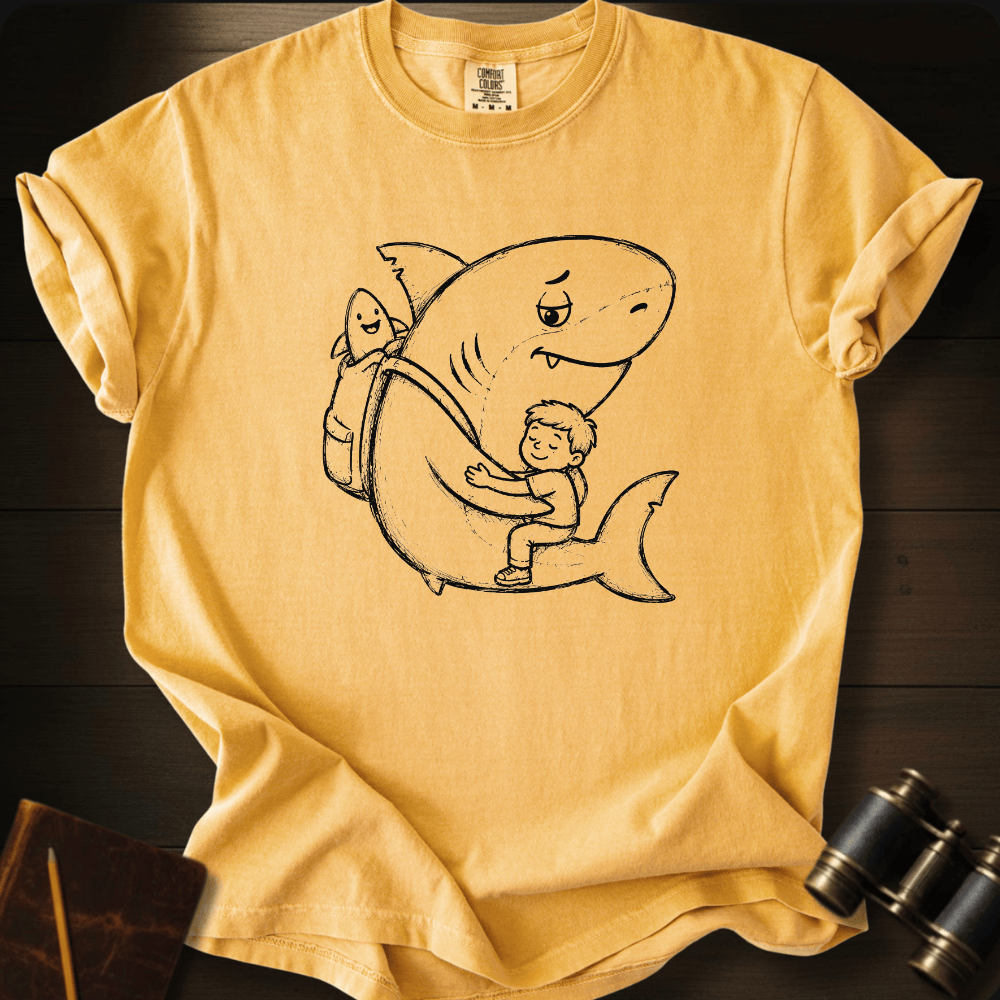 Friendly shark and little kid line-art graphic centered on a golden yellow heavyweight cotton t-shirt.